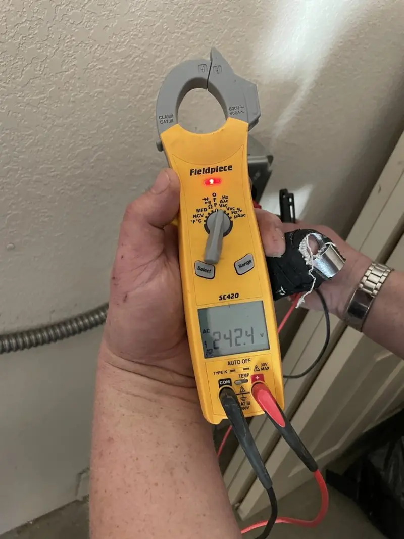 Voltage testing with clamp meter during Circuit Breaker Repair in Chesapeake Ranch Estates